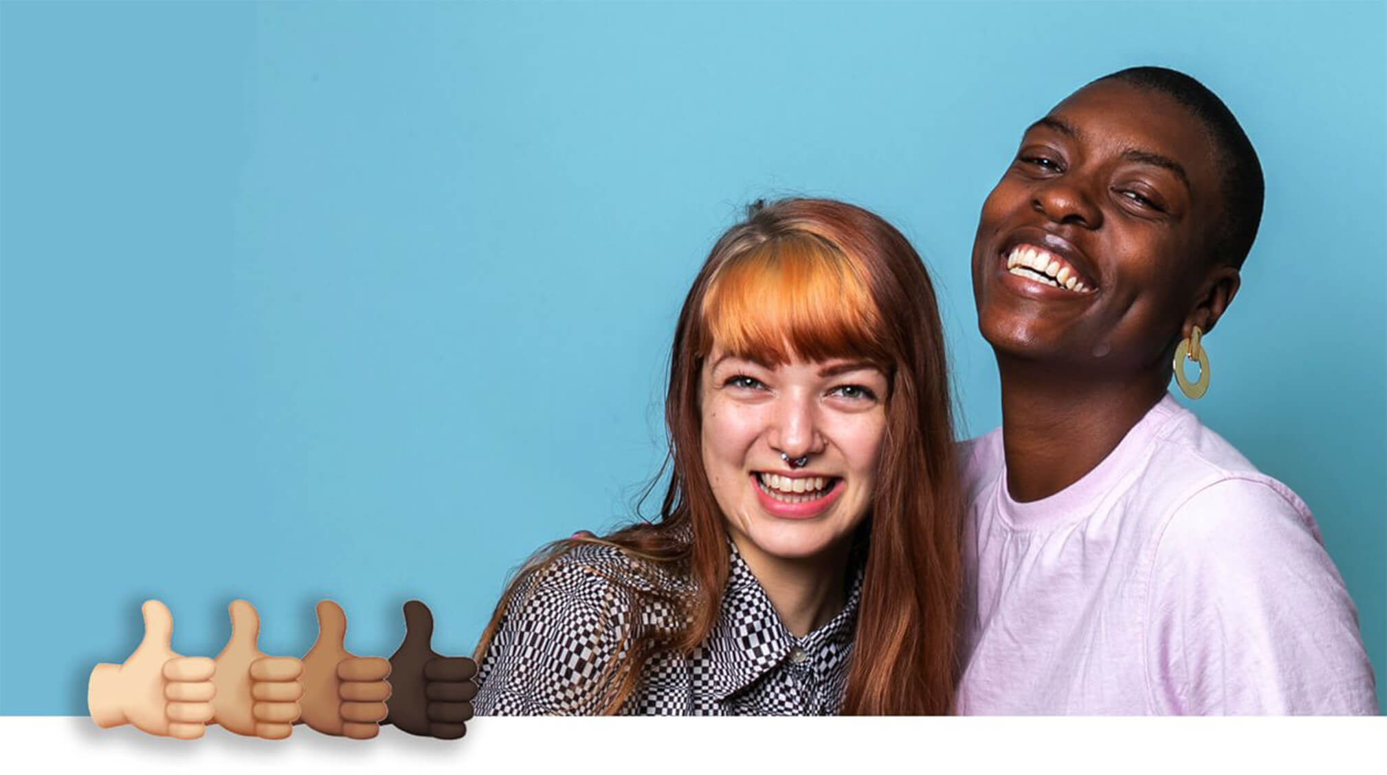 Caucasian girl and African American girl smiling