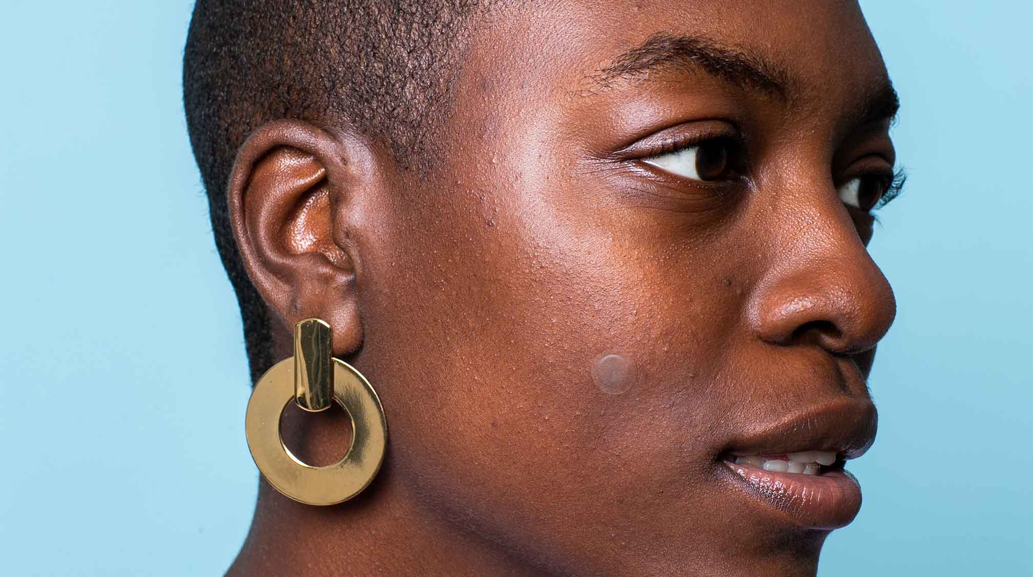 African American woman with blue background